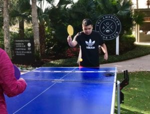Child with autism playing ping pong at Sawgrass Marriott