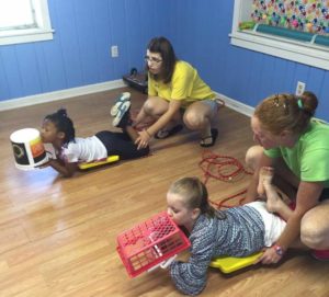 Faith Therapeutics game with kids on floor