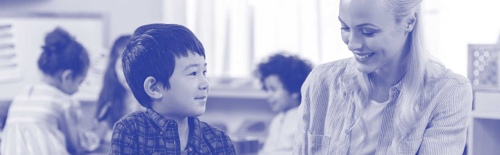Teacher smiling and young asian student