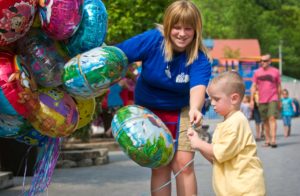 young boy getting ballon from Knoebels staff