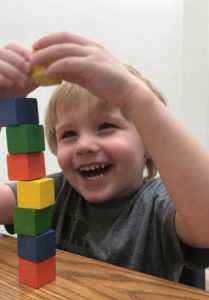 boy playing with blocks at Cutting Edge Therapy