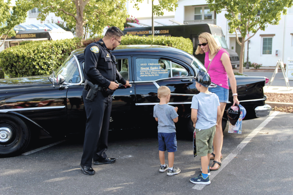 Morgan Hill Police officer show a family car