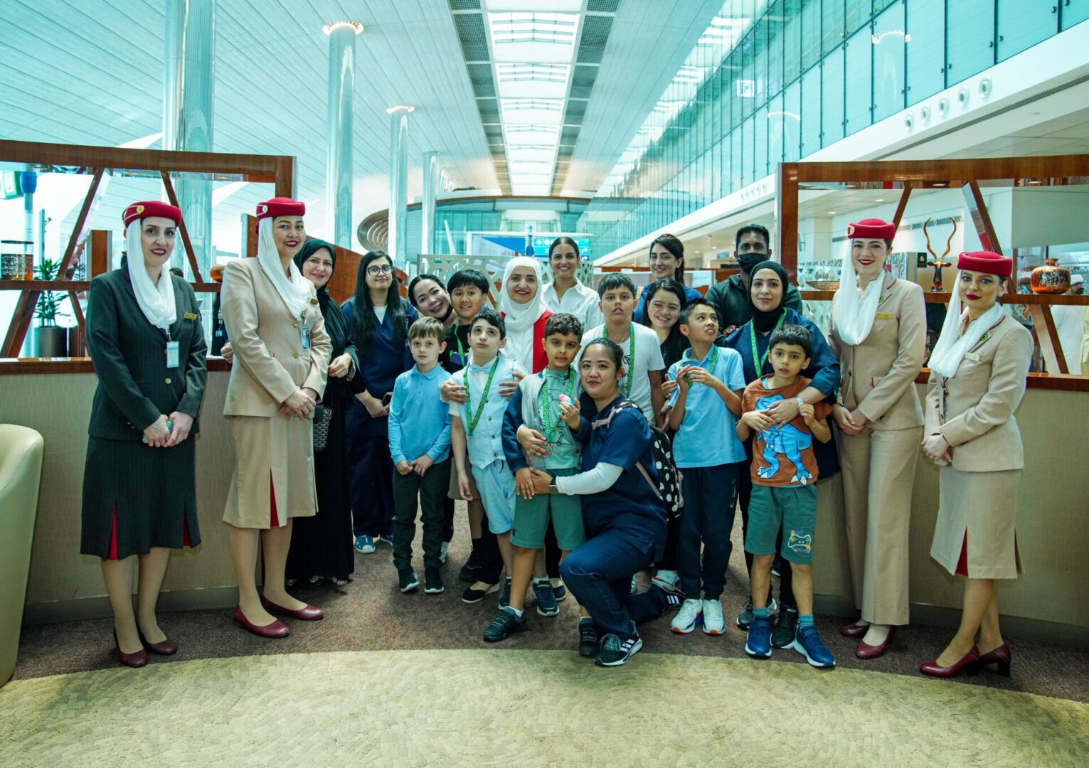 Group of Emirates staff with neurodiverse children