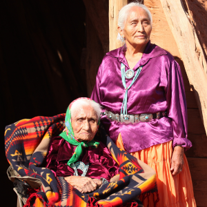 Two elderly Navajo women in colorful clothing